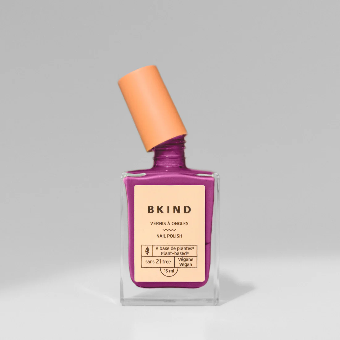 Aries nail polish - a purple colour displayed in square nail polish container with cap seperated
